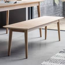 Meranti wood solids and teak wood inlays give this striking wood bench its distinctive style. Tortona Dining Bench Cuckooland Cuckooland