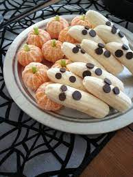 Healthy Halloween Themed Snacks Banana Ghosts And Clementine Pumpkins Food Halloween Themed Snacks Halloween Food For Party