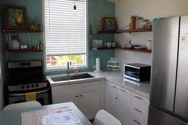 The indigo kitchen design may be minimalist, but it has everything you need in a stylish manner. Photos Of Tiny House Kitchens That Show Just How Creative Homeowners Can Be Insider