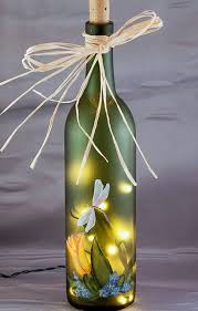 Pin By Sam Mzr On Painted Furniture Bottle Crafts Wine Bottle Art Lighted Wine Bottles Diy light wine bottle with floral print via. pinterest