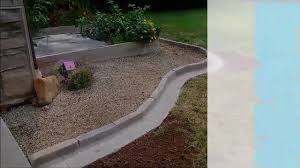 Edging your flower bed does much more than make it look neat and tidy. Landscape Garden Edging Using Pavers Stones Youtube