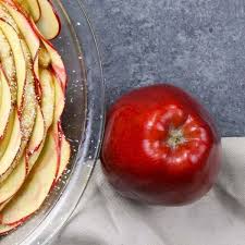 This Is A Photo Of A Red Delicious Apple Next To A Cinnamon Roll Apple Rose Dessert Made W Red Delicious Apples Recipes Red Delicious Apples Apple Recipes Easy