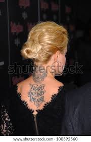 Suvari has a large script tattoo on her back, which reads 'word, sound, power', as well as the head of a lion on her neck, a word just above the lion and a smaller tattoo on her chest. Mena Suvari At The Rolling Stone American Music Awards Vip After Party Rolling Stone Restaurant Lounge Hollywood Ca 11 21 10 Stock Images Page Everypixel