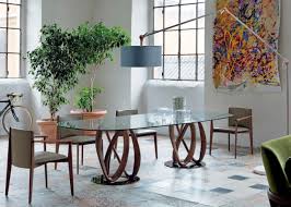 Others may prefer a very slim ¾ thick table top on a geometric table base, for a floating look. Porada Infinity Oval Glass Dual Base