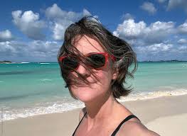 Woman Takes A Happy Sea, Sand & Wind Vacation Selfie On Bahamas Beach" by  Stocksy Contributor "Cara Dolan"