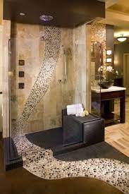 If you are planning a new bathroom design then this article on 50 bathroom tile ideas will provide some useful inspiration when it comes to mosaics, wall and if you are on the lookout for some ideas on how you can transform the look of your bathroom with tiles then you have arrived at the right place. A River Of Pebble Stones In This Shower Can Be A Unique Expression Of Your Personality Bathroom Remodel Photos Bathrooms Remodel Tile Bathroom