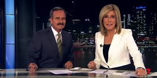 Presenter telling breaking news from tv screen journalist speaking of coronavirus pandemic over the shoulder shot. Seven News Launches Daily Gold Coast Bulletins Mediaweek