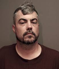 On June 18, 2025, shortly after 12:00 p.m., officers responded to reports  of a disturbance in a business parking lot