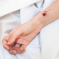 Flower tattoos on the is a timeless tattoo. Red Rose Tattoo On The Wrist