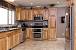 Tile Backsplash With Natural Hickory Cabinets