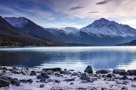 An Icy View Of Alaska Mountains Over Water In Lake Eklutna Stock Photo A87e11d1 C66c 4f44 934e Ad221cc35b20