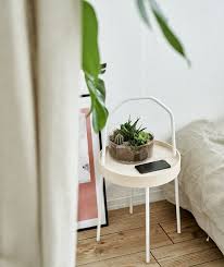 A White Burvik Side Table With Terrarium In A White Bedroom Decorating Small Spaces Urban Apartment Small Spaces