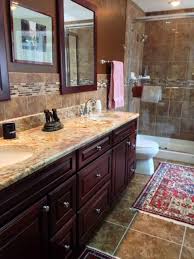 Giallo napoleone granite bathroom if you are looking for a natural pop of color and style, you cannot go wrong with giallo napoleone granite, featured here on this vanity top. Master Bathroom Sienna Bordeaux Granite Countertops Yorktowne Cherry Brand Granite Bathroom Countertops Kitchen Countertops Granite Colors Bathrooms Remodel