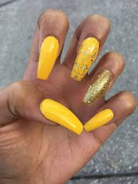 Trendy yellow nails with marble nail art. 10 Nail Polish For Dark Skin Tones To Compliment The Beauty Yellow Nails Acrylic Nails Yellow Yellow Nail Polish