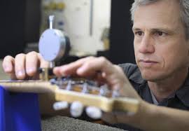 In a rural Petaluma repair shop, guitars are fixed, finessed and created