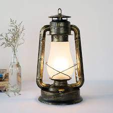 These unique designs are perfectly sized for a bedside table: Retro Vintage Kerosene Lantern Table Lamp For Cafe Bar Living Room Bedroom Bedside Iron Glass Desk Light H 40cm 1442 Lantern Table Lamp Table Lamplamp Table Lamp Aliexpress