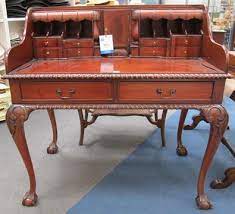 Check spelling or type a new query. A Reproduction Mahogany Writing Desk With Numerous Drawers Pigeon Holes Secret Compartment And