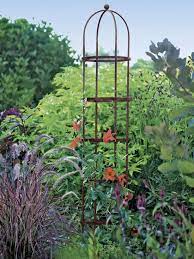 The first is to tie the rose canes onto the face of the trellis with a soft twist tie, rather than weaving the rose through the lattice, as this can damage canes and make the bush harder to keep under control. Jardin Round Garden Obelisk Tuteur 7 Ft Gardeners Com