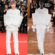 Chinese singer li yuchun poses at a premiere for new movie 'the breakup guru' in beijing, china, june 24, 2014. Chris Lee In Balmain Couture At The Les Miserables 72nd Cannes Film Festival Premiere