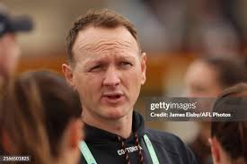 Mia Austin of the Blues competes with Jessica Allan of the Crows... News  Photo