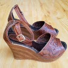 Smooth faux leather creates a slender toe strap and matching wrapping ankle strap with a shiny gold buckle. Shoes Tooled Mexican Leather Peep Toe Wedge Sandals Poshmark