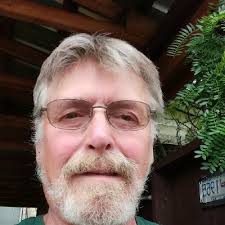 To avoid using heavy machinery in Kentucky's Peabody Wildlife Management  Area, TVA pilot Ricky Roberson positions his helicopter so lineman Cody  Young can remove spacers from a retired 500-kilovolt…