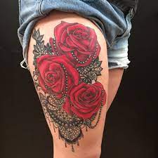 Though, people these days are getting them tattooed on their palms, fingers, back of the ear and neck as well. Red Rose Pearl And Lace Thigh Tattoo By Colby Morton Working Class Tattoo In Kansas City Mo Lace Thigh Tattoos Lace Tattoo Lace Rose Tattoos