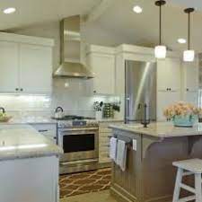 It may be neater to cut a square hole through to the attic and drop a rectangular duct cover down to the hood. Kitchen Extractor Vaulted Ceiling Novocom Top