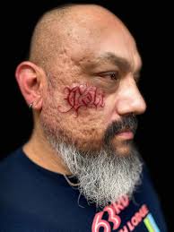 Cali” free handed and tattooed by our fearless leader Brandon Whitehead!!  #jobstopper #facetattoos #lettering #customlettering