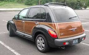 Chrysler Pt Cruiser With Woodgrain I Loved The Look Of These But Never Bought One Because Chrysler S Reliability Made Chrysler Pt Cruiser Cruisers Turbo Car