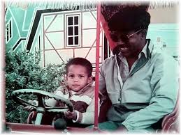 my son TJ, born at 97th Gen Hosp 12 Aug 82 and his godfather Ronald Askew  at the annual fest in Platen Hsg Area at field by Platen Elementary School  around 1984...