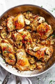 Golden Seared Garlic Mushroom Chicken Thighs In A Delicious Buttery Sauce With A Sprink Chicken Thights Recipes Boneless Chicken Thigh Recipes Chicken Recipes