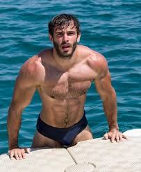 Group of friends sunbathing and having fun on the beach. We Love Hot Guys Fit Hot Guys On The Beach