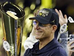 Harbaugh won't serve as honorary captain for Michigan's season opener