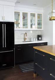 Black Refrigerator With Black Base Cabinets And White Upper Cabinets Marble Subway Tile Bras White Kitchen Design Black Kitchen Cabinets Kitchen Cabinet Design