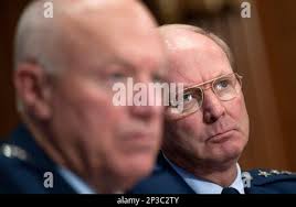 Director of the Air National Guard, Lt. Gen. L. Scott Rice, and ANG Command  Chief Master Sgt. Ronald Anderson, laugh with 130th Airlift Wing recruiter,  Tech. Sgt. Anthony Sherrod, during a visit