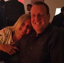 Should I remove the three big trees/bushes and how to redesign the  landscaping for a more lively look?