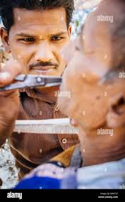 Indian street barber hi-res stock photography and images