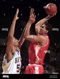 Sam Houston State forward David Amaya, right, shoots over Baylor center Ben  Echols during the first half in Waco, Texas, Tuesday Dec. 7, 1999. (AP  Photo/Waco Tribune Herald, Rod Aydelotte Stock Photo -