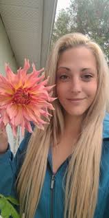 Sparrows posing in the sunshine with a dahlia in my garden called 'Penhill  Watermelon', just before the dahlias were lifted and packed away for the  winter.