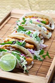 Combine the cabbage, lime juice, scallions, jalapeno and cilantro in a large bowl. Coconut Tempura Fish Tacos With Mint Cabbage Slaw Byron Chilli