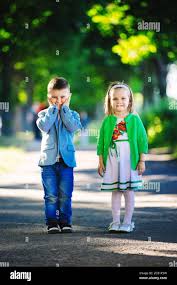 Children S Love A Little Boy And A Girl Having Fun Laugh And Smile And Kiss Outdoors Stock Photo Alamy