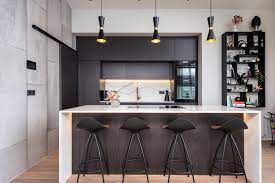 A trio of ellipse grand pendants in gray glass hang from individual junction boxes above the kitchen island. Kitchen Island Lighting Here Is What You Need To Know Mullan Lighting