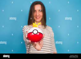 Ufa, Russia - July 8, 2017: woman holding pokeball with pikachu. pokemon go  multiplayer game with elements of augmented reality. Catching the Vaporeon  pokemon Stock Photo - Alamy