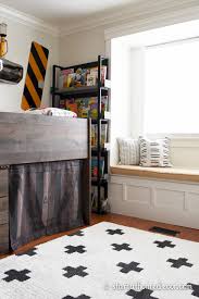 Top the window seat with a cushion for comfort and add fun pillows. Diy Window Seat Storage Start At Home Decor