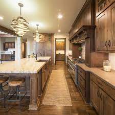 Rather than using glossy stain finishes, rustic cabinets may be left rugged or matte to accentuate the authentic feel of the wood used. 75 Beautiful Rustic Kitchen With Dark Wood Cabinets Pictures Ideas June 2021 Houzz