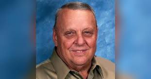 John E. Martin Obituary