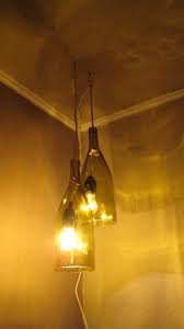 Inspired by the fresnel lens which is used in lighthouses around the world to help ships avoid treacherous coastlines. Remodelaholic How To Make A Glass Wine Bottle Pendant Light Diy