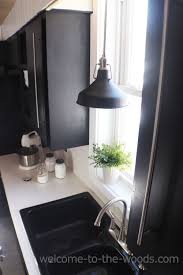 Modern Lighting For Our Old Farmhouse Black Kitchen Cabinets Living Room Decor Gray Hanging Lights