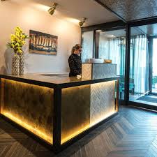 The reception is a place which is stylistically matched with the rest of the hotel hall but quite clearly marked. Hotel Reception Design Bespoke Reception Desks Furnotel